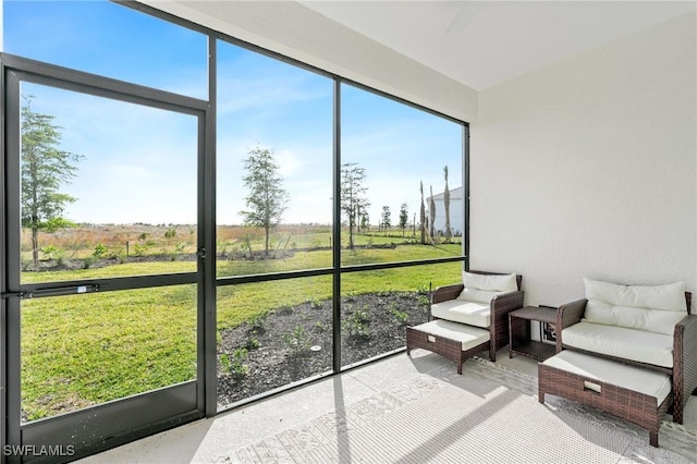 sunroom / solarium featuring a rural view