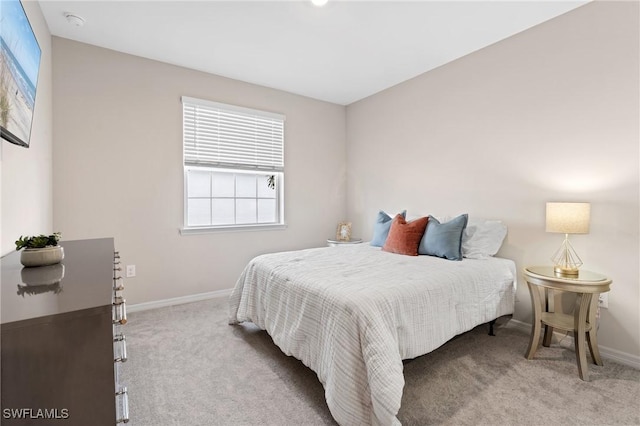 bedroom with light carpet