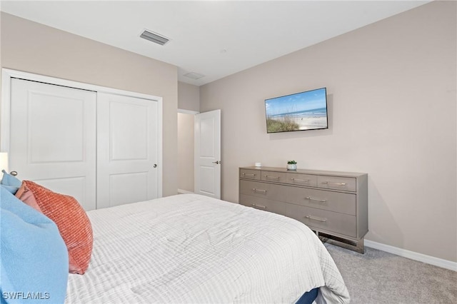 carpeted bedroom featuring a closet