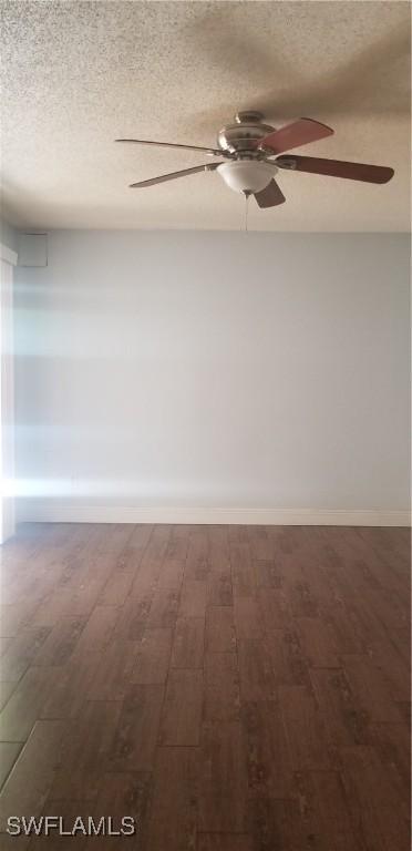 unfurnished room with ceiling fan, hardwood / wood-style floors, and a textured ceiling