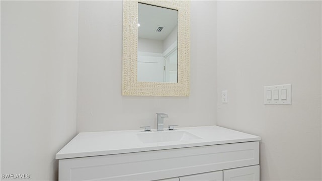 bathroom featuring visible vents and vanity