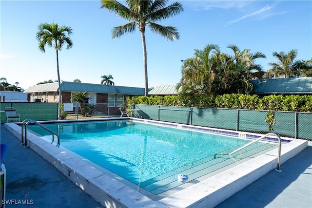 community pool featuring fence