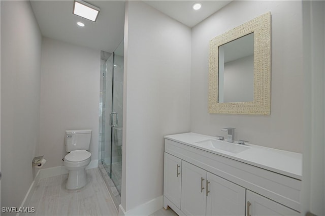 full bath with recessed lighting, toilet, a shower stall, vanity, and baseboards