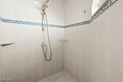 bathroom with tiled shower