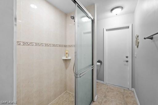 bathroom featuring tile patterned floors and walk in shower