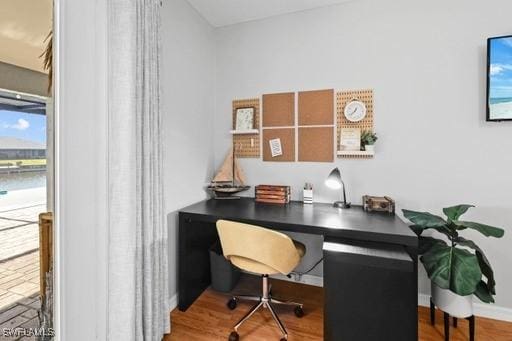 home office featuring light hardwood / wood-style floors