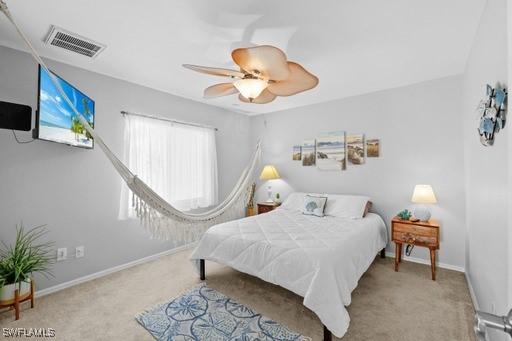 carpeted bedroom featuring ceiling fan