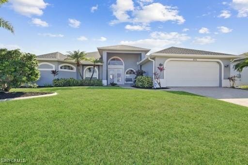 view of front of home featuring a garage and a front lawn