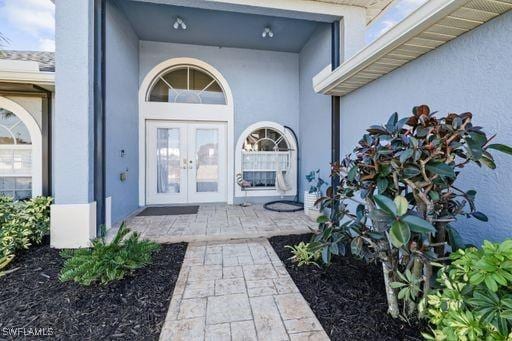 property entrance featuring french doors