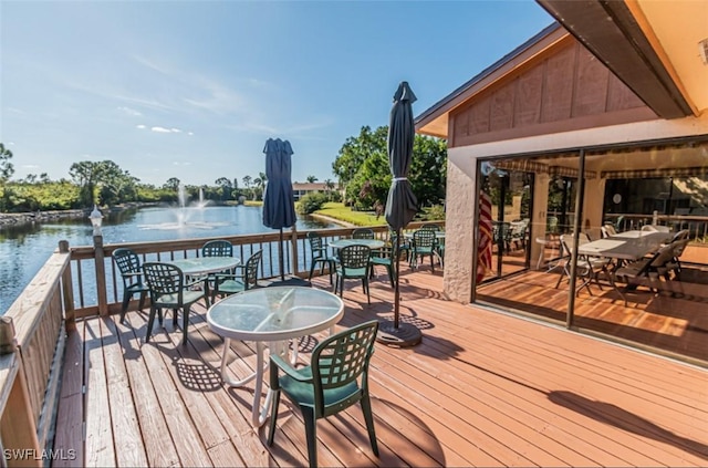 wooden deck with a water view