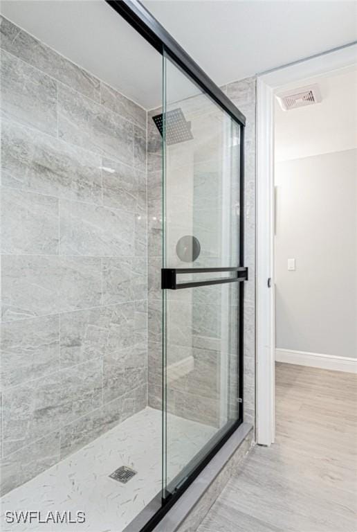 bathroom featuring an enclosed shower