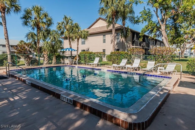 view of swimming pool with a patio