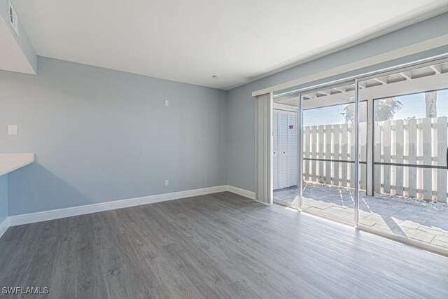 unfurnished room featuring hardwood / wood-style floors