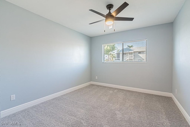 empty room with carpet and ceiling fan