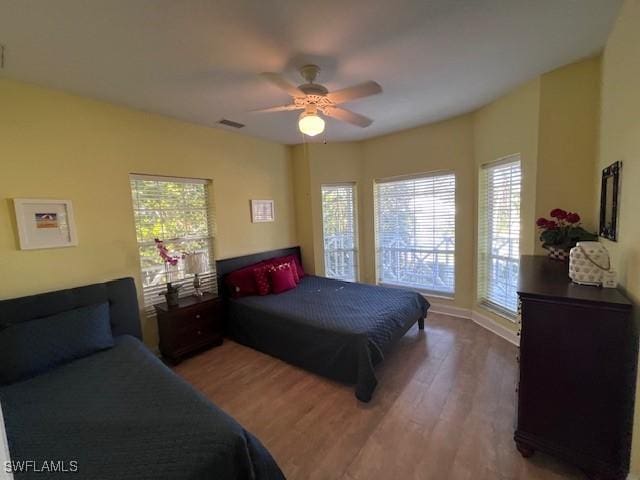 bedroom featuring hardwood / wood-style flooring and ceiling fan