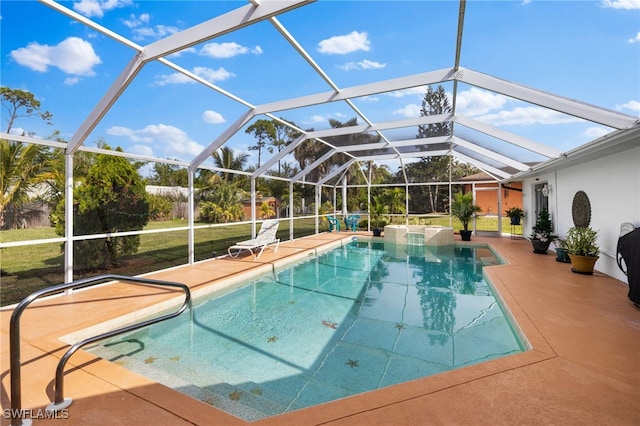 view of pool featuring a patio area, a lanai, and a yard