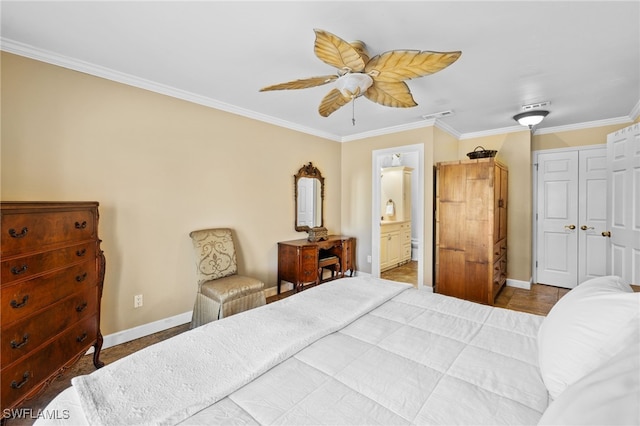 bedroom featuring a closet, ensuite bathroom, ceiling fan, and ornamental molding