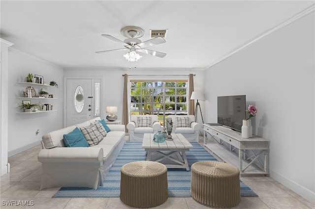 living room featuring light tile patterned floors, ceiling fan, and ornamental molding