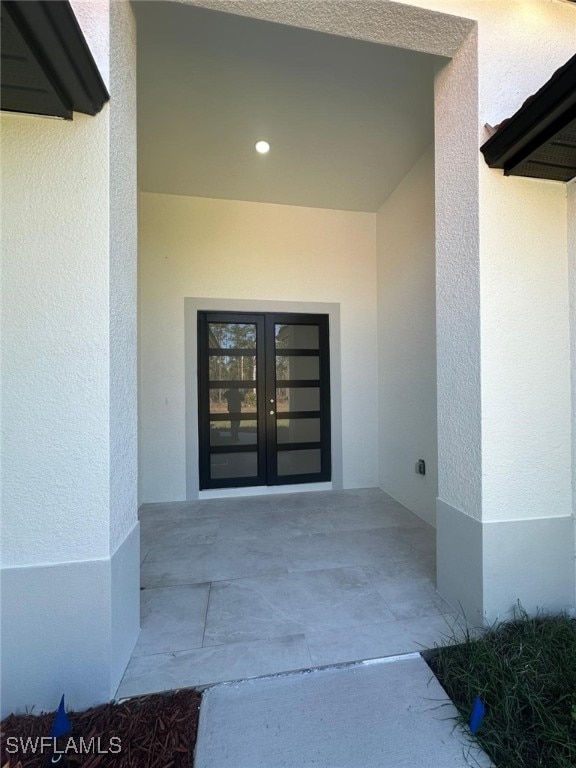 doorway to property featuring a patio area and french doors