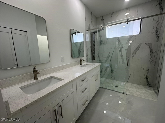 bathroom with vanity and a shower with shower door