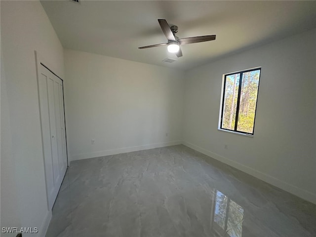 unfurnished room with ceiling fan