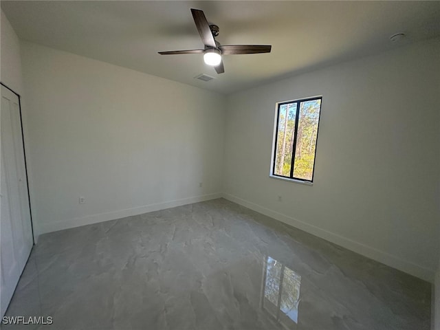 unfurnished room with ceiling fan