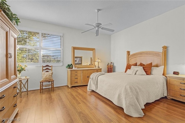 bedroom with ceiling fan and light wood-type flooring