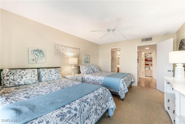 bedroom with light colored carpet and ceiling fan