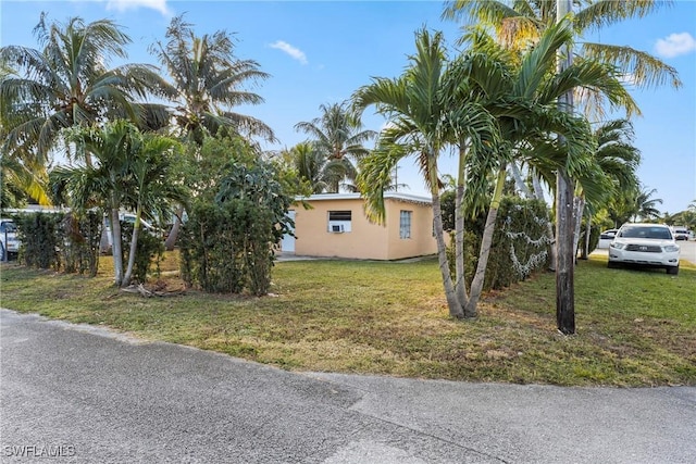 view of home's exterior featuring a lawn