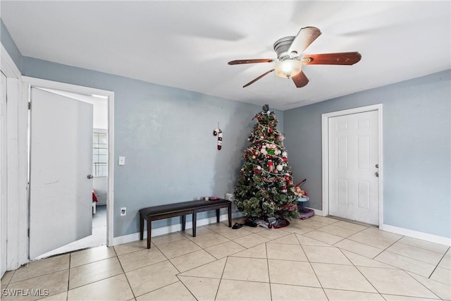 entrance foyer featuring ceiling fan and light tile patterned floors