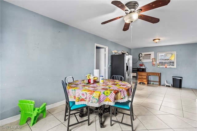 tiled dining room with ceiling fan and a wall mounted air conditioner