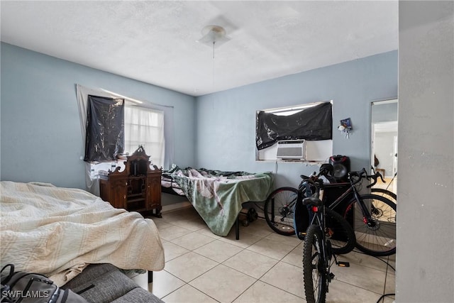 bedroom featuring cooling unit and light tile patterned flooring