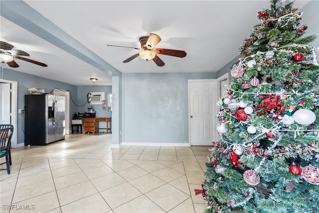 tiled foyer featuring a wall mounted AC and ceiling fan