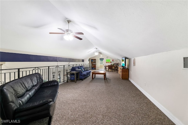 living room with lofted ceiling, carpet, and baseboards