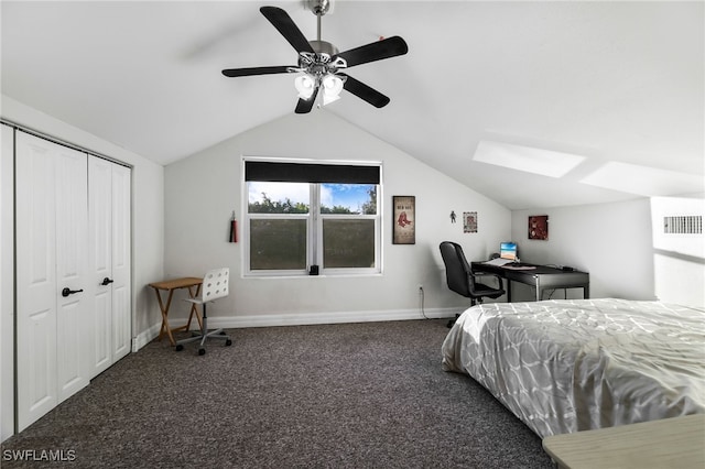 carpeted bedroom with ceiling fan, a closet, and vaulted ceiling