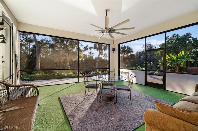 sunroom / solarium featuring ceiling fan