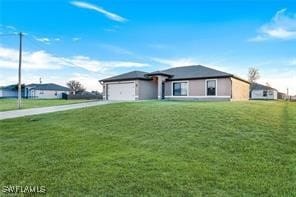 view of front of property with a front lawn and a garage