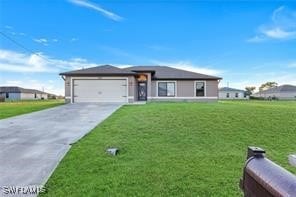 view of front facade with a garage and a front lawn