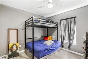 bedroom with hardwood / wood-style flooring and ceiling fan