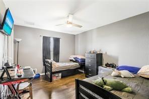 bedroom featuring ceiling fan and wood-type flooring