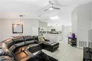 tiled living room featuring ceiling fan