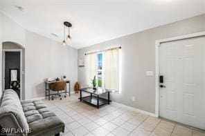 living room featuring light tile patterned flooring