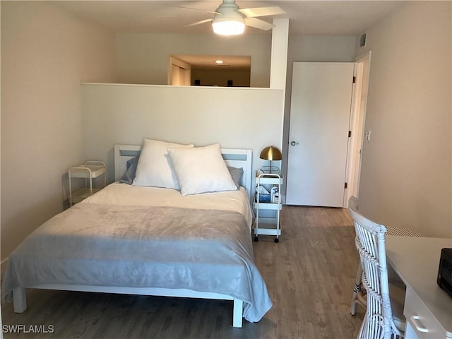 bedroom featuring hardwood / wood-style floors and ceiling fan