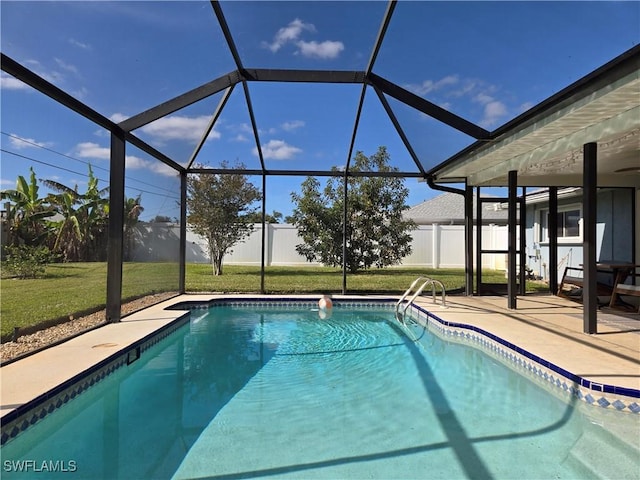 view of swimming pool featuring a yard, a patio, and glass enclosure