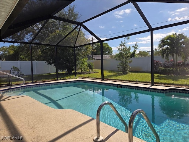 view of swimming pool with a lanai and a lawn