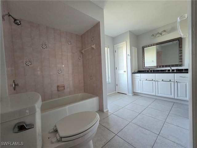 full bathroom featuring vanity, tiled shower / bath combo, tile patterned floors, and toilet