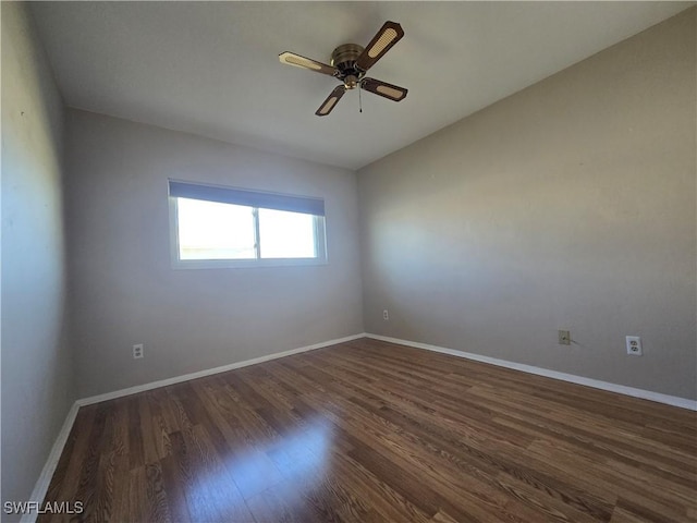 unfurnished room featuring dark wood-type flooring, ceiling fan, and lofted ceiling