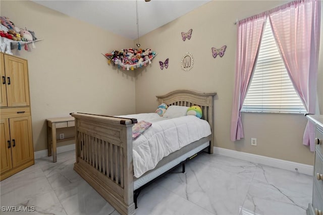 bedroom featuring multiple windows