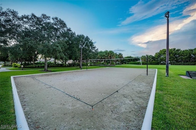 view of home's community featuring volleyball court and a lawn