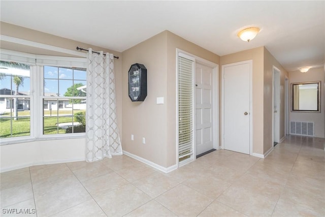 entryway featuring light tile patterned flooring